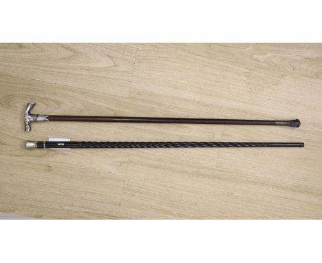   A 19th century Ceylonese ebony and silver topped walking stick and a white metal handled walking stick