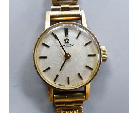   A ladys' Omega 9ct gold manual wind wristwatch, overall length 15.2cm, gross weight 15 grams, with Omega box.