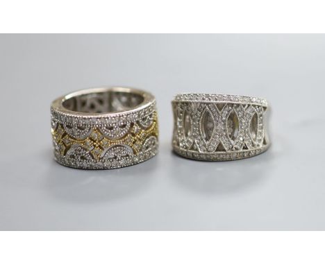   Two modern pierced yellow and white metal, diamond chip cluster rings, sizes K M, gross weight 18.9 grams.