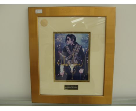 A Michael Jackson colour photograph 11" x 8" framed, glazed & mounted signed in gold ink Michael Jackson with COA