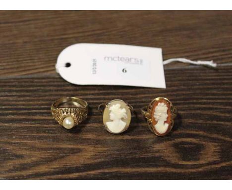 TWO 2OTH-CENTURY CAMEO RINGS
along with a 1970s pearl set dress ring, all in gold (3)