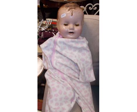 VINTAGE PLASTIC DOLL
63cm long
Cracks to the doll's head