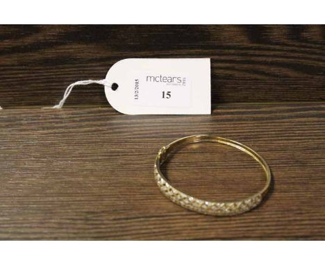 NINE CARAT GOLD DIAMOND SET BANGLE
of pierced form
No damage