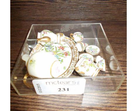 ROYAL WORCESTER MINIATURE HELMET JUG
signed Powell, and a miniature Limoges tete-a-tete tea set
Good condition