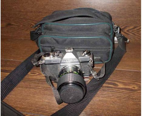 PENTAX K1000 CAMERA
with a Pentax 15mm lens and a Centon 2870 zoom lens, with case