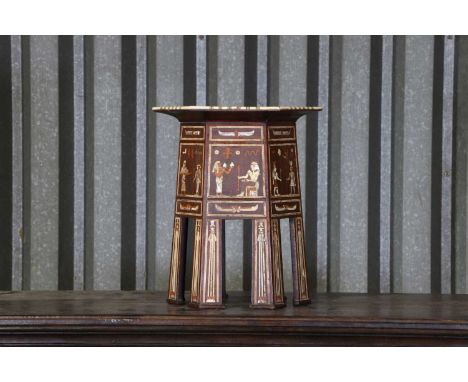 An Egyptian Revival inlaid wine table, early 20th century and later, decorated with bone, mother-of-pearl and various woods, 