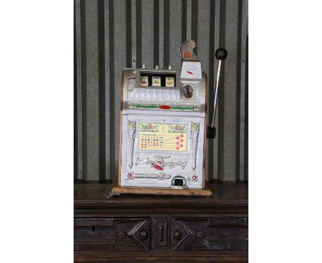 A one-armed bandit slot machine,20th century and later, American, by Mills Novelty of Chicago, 43cm wide43cm deep64cm high
Co