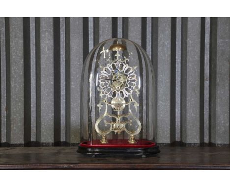 A brass skeleton clock,19th century and later, the silvered dial set with Roman numerals, with an ebonised wooden stand and u