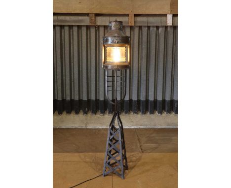 A copper and brass buoy lantern by Pascall Atkey &amp; Sons, Cowes,early 20th century and later, converted into a floor lamp,