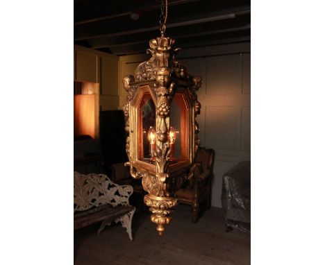 A Renaissance-style giltwood lantern,19th century and later, Italian, with figural and foliate decoration, 37cm wide37cm deep