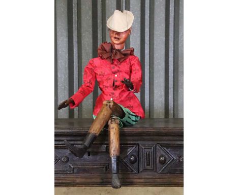 A painted fruitwood Pinocchio puppet, late 19th century, Neapolitan, 100cm highCondition ReportRepair and restoration. Clothi