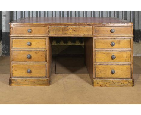 A Victorian cedar partners' desk,with an inset red leather top and an arrangement of drawers to each side,176cm wide132cm dee