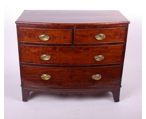 A George III mahogany bowfront chest of four drawers on swept bracket feet 82cm high, 98cm wide 