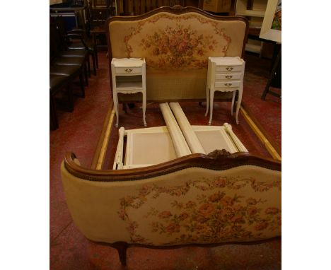 A French style painted single bed frame, a pair of painted bedside cabinets and a Louis XV style bed with shaped needlework p