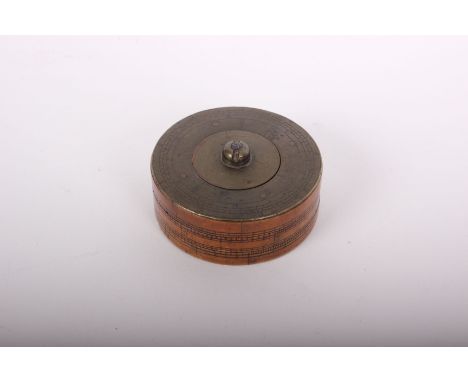 A late 18th century brass and boxwood cylindrical calculator, the top section rotating with three logarithmic scales to top a