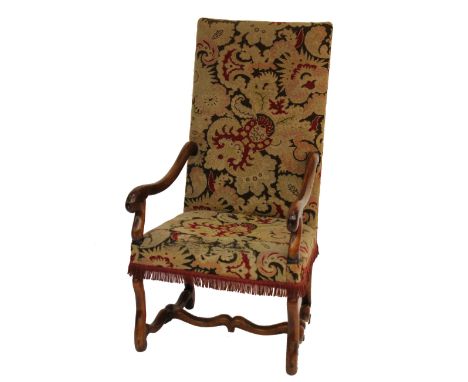 An 18th Century and later walnut open armchair with shaped 'H' stretcher covered in tapestry,  118cm high