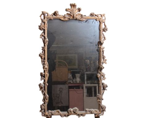 Two gilt framed mirrors; A triple panel over mantel 46cm x 112cm and a deep scrolled gesso framed wall mirror 102cm x 62cm