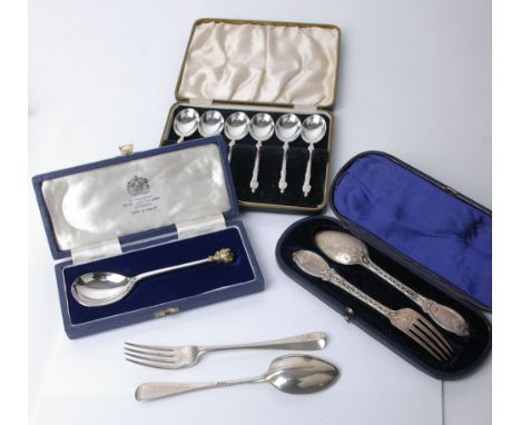 A collection of silver flatware, comprising; a Victorian christening spoon and fork, London 1868 by G W Adams; a rat tail chr