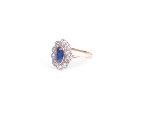 An early 20th century gold, sapphire and diamond oval cluster ring, centred with an oval mixed-cut sapphire approx. 1.55cts, 