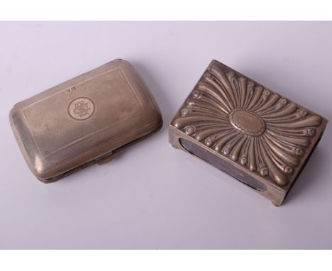 A silver engine turned oblong cigarette case, with a central cartouche with a monogram ‘SMD’, Birmingham 1923, 52g; and a lar