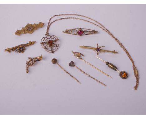 A collection of Victorian and later gold jewellery, including an Edwardian gold, citrine and half-pearl open work pendant, on