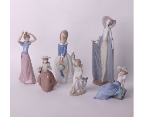 A Lladro figurine: tall cloaked lady (no.1428) and five Nao figurines of young girls (6)