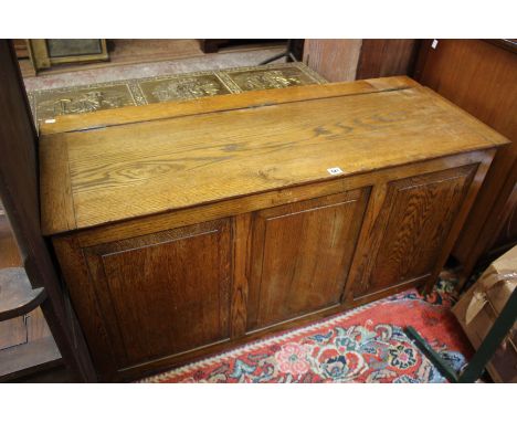 An oak panel front coffer circa 1930's, a hall stand and a standard lamp