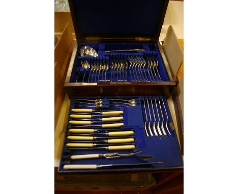 A canteen of silver cutlery. A silver old English pattern table service, in a mahogany canteen with brass mounts and retailer