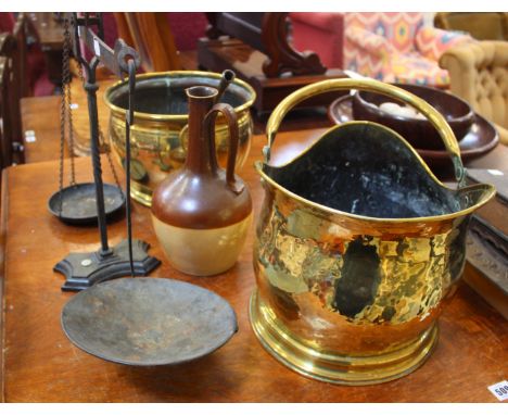 A brass coal scuttle, beam scales, brass jardiniere, stoneware bottle and a spear head (5)