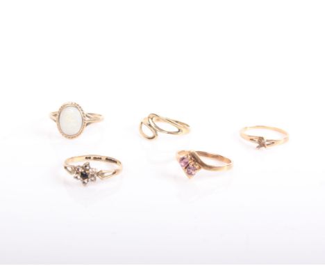 Five various 9ct gold rings, comprising: a white-opal oval-cabochon single stone ring, London 1977; a pale pink ruby two ston