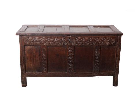 An oak panel coffer, the front scratch carved. 17th century and later.w.123cm h.66cm