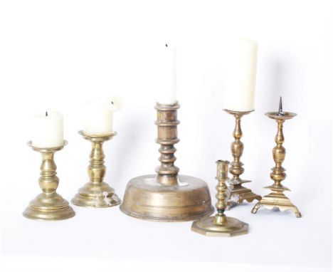 Metalware: Two pairs of brass pricket sticks, a heavy base 'bell' candle stick and four other items