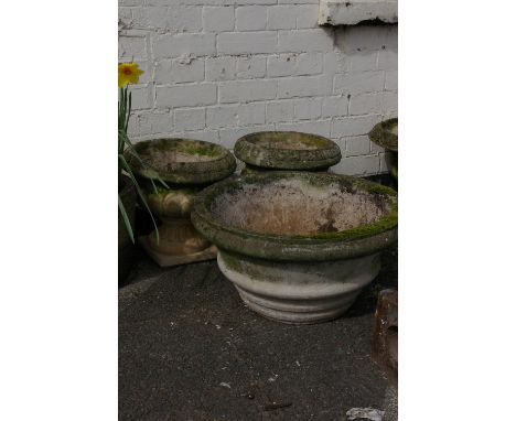A pair of pedestal urns in Georgian style and one other larger planter, weathered concrete