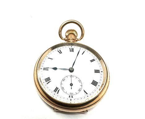 Antique  gold plated open face  pocket watch the watch is ticking 