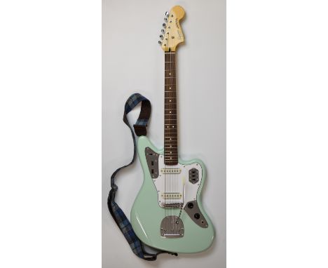 Squire Jaguar electric guitar by Fender in Surf Green finish with Duncan single coil pickups and 22 frets, serial no. 1828445