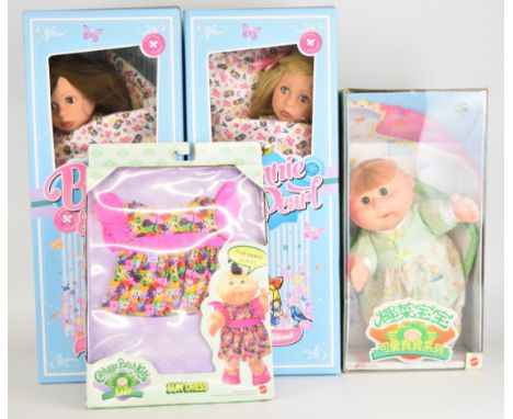 Three vinyl bodied dolls comprising two Bonnie and Pearl and one Cabbage Patch Kids, together with a clothing/accessory pack,