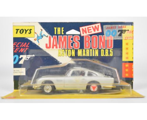 Corgi Toys diecast model James Bond 007 Aston Martin DB5 with silver body, red interior, opening roof / ejector seat, bandit 