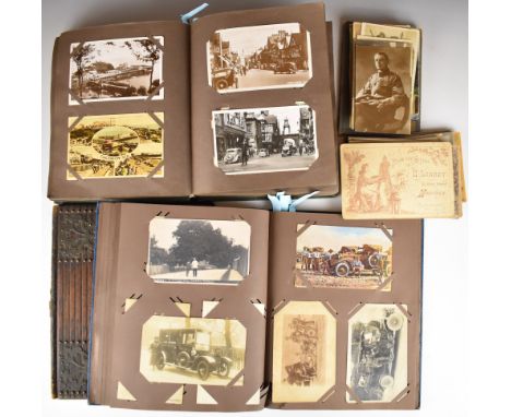 Over 420 postcards in two albums / loose and a Victorian Gothic Revival brass and oak book cover, cards include topographical