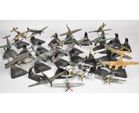 Twenty-three Atlas Editions diecast model military aeroplanes, with display stands.