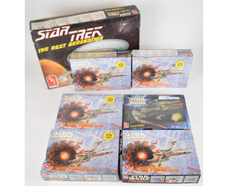 Seven AMT Ertl Sci-Fi plastic model kits comprising five Star Wars X-Wing Fighter 8932, a Trade Federation Droid Fighter 3011