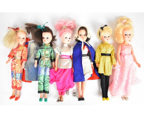 Six vintage Sindy dolls by Pedigree dressed in 1970's &amp; 80's outfits to include Nurse, Space Fantasy, Pop Singer and Star