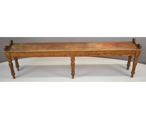 19thC ash window seat or low bench with scroll ends, raised on six turned legs, W193 x D30 x H46cm