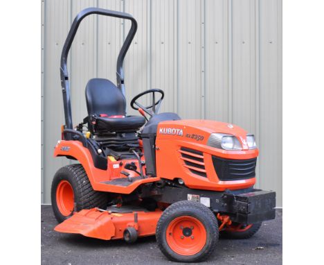 Kubota BX2350 mini tractor mower with three point linkage, power take off (PTO), hydraulics, towing hitch, electric lights, l