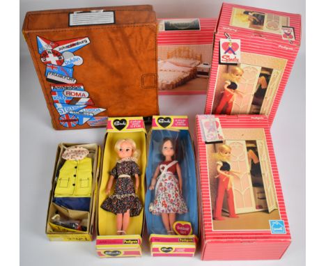 A collection of vintage Sindy items comprising two dolls, furniture, clothing and accessories, some in original boxes.