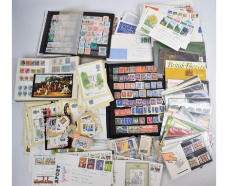 A collection of GB and world stamps in three stock albums, and GB presentation packs and first day covers