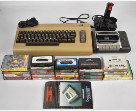 Commodore 64 retro gaming system together with power supply, cassette deck, joystick and a collection of games including Buck