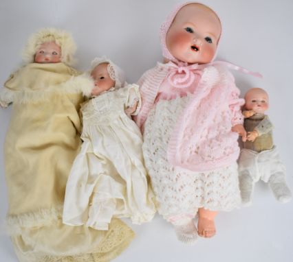 Four Armand Marseille bisque headed dolls each marked AM Germany to back of neck, tallest 47cm.