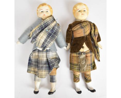 Two small Victorian dolls in traditional Scottish dress, each with a cloth body, ceramic head/limbs and painted features. hei