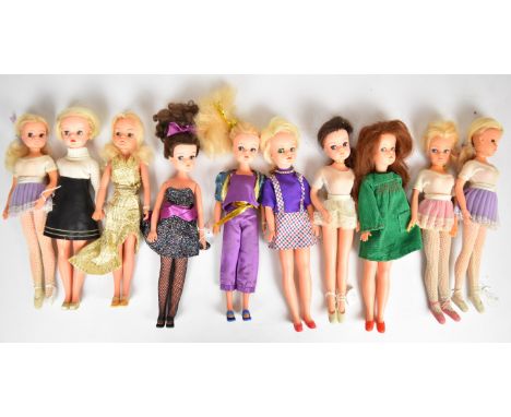 Ten vintage Sindy dolls by Pedigree dressed in clothing ranging from the 1960's to 80's.