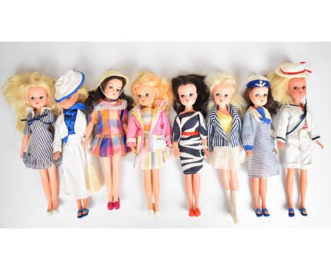 Eight vintage Sindy dolls by Pedigree dressed in 1980's outfits to include Ahoy There, Check Mate, Miss Sindy and Boutique.